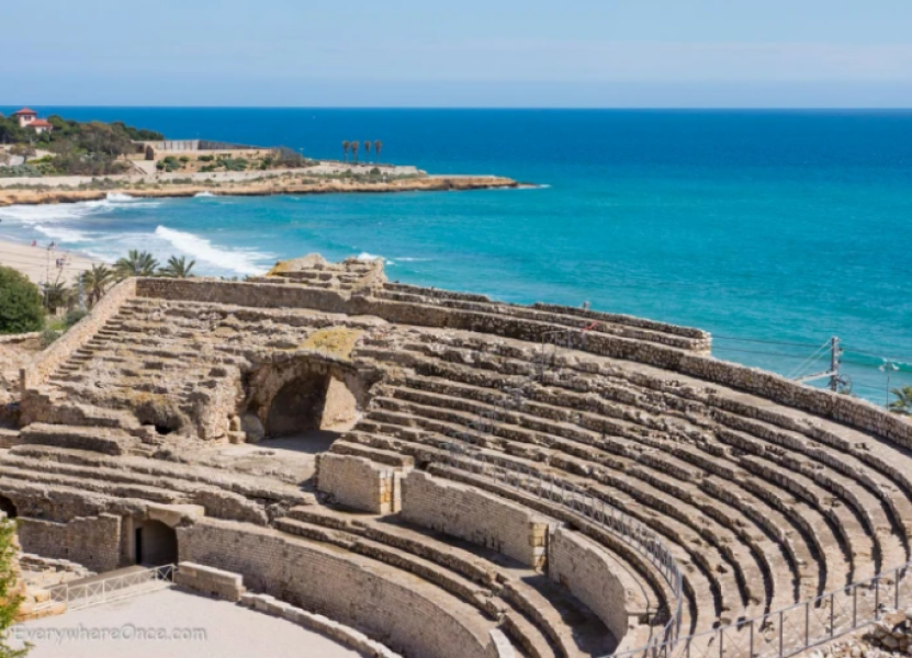 Sandy beach with ancient ruins nearby