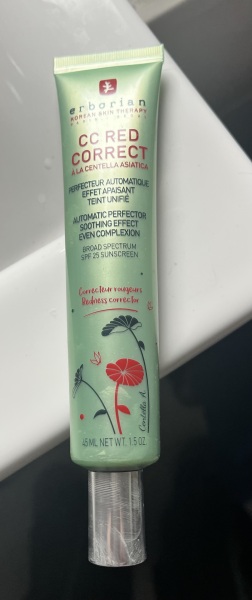 Choosing a colour corrective cream for old woman with red face.