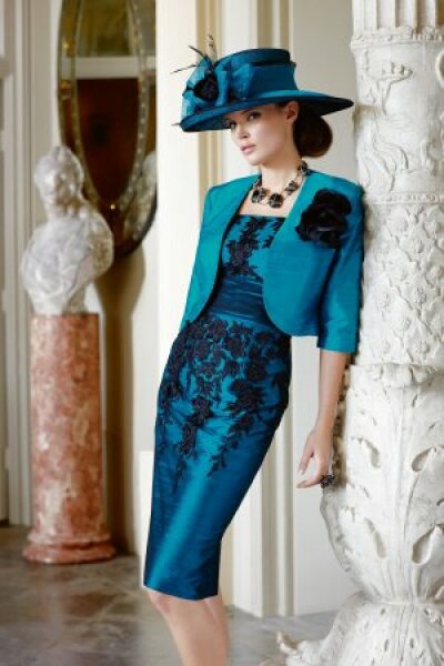 Why is the go to mother of bride outfit a hideous stiff coat dress with hat?