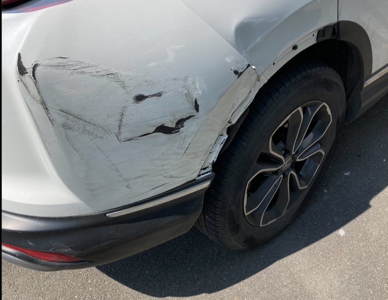 Dinged someones car door and drove away