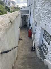 Help with dark dingy outdoor passageway to our front door?