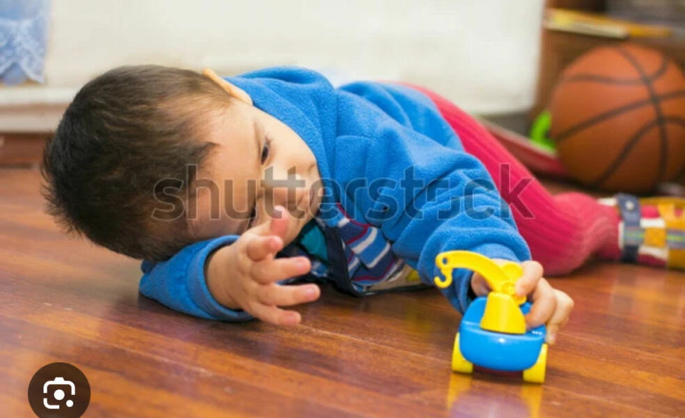 Laying down to play with cars