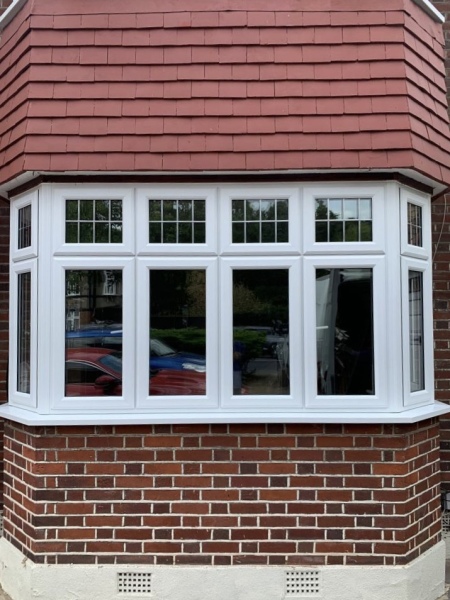 Criss cross window or clear glazing for mock Tudor house?
