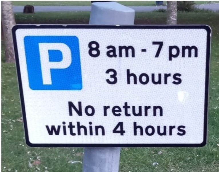 Parking restriction sign: 3 hours, no return within 4 hours