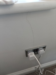 Crack below two windows