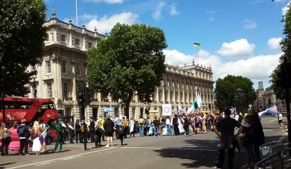Sarah Jane Baker leads topless protest in London, and threatens named women