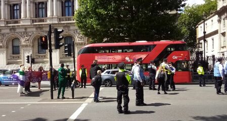 Sarah Jane Baker leads topless protest in London, and threatens named women