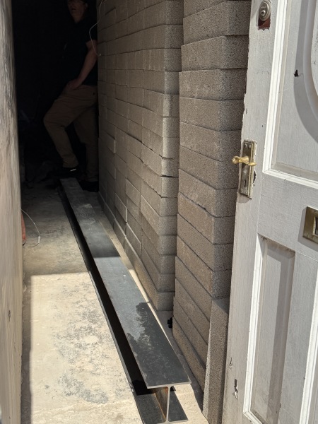 What the heck is this guy doing next door?