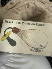 Can you decipher two words on this antique postcard?