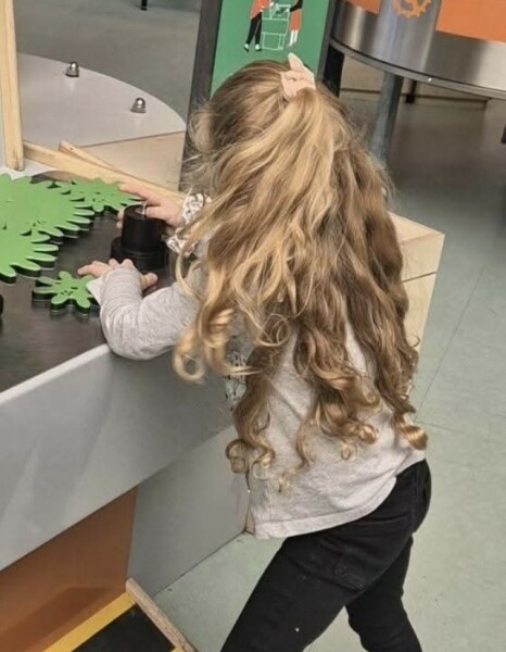 At what age did you start putting bobbles in baby's hair?