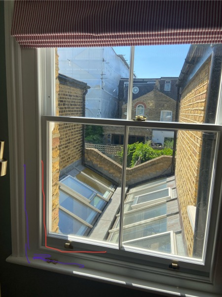 Curtain pole for window in corner of room