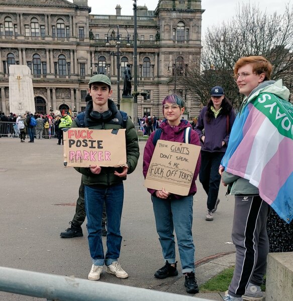 arrested at Pride for wearing a sign saying Trans=mental illness