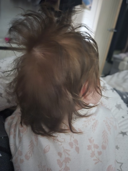 At what age did you start putting bobbles in baby's hair?