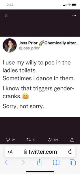 arrested at Pride for wearing a sign saying Trans=mental illness