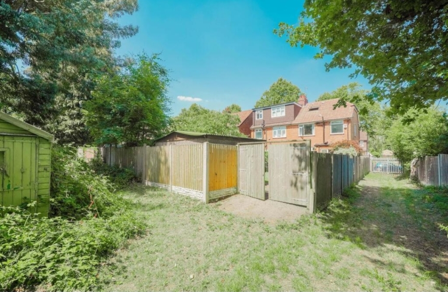 House with driveway at the back