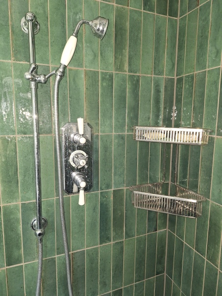 Small tiles in shower.