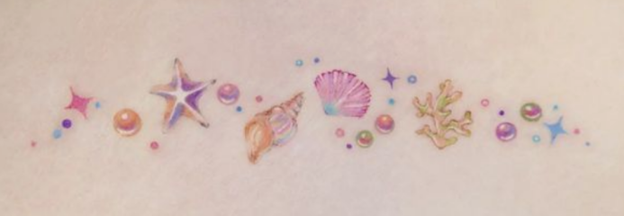 Does anyone actually have a tattoo like this? (Tiny, colourful realism)