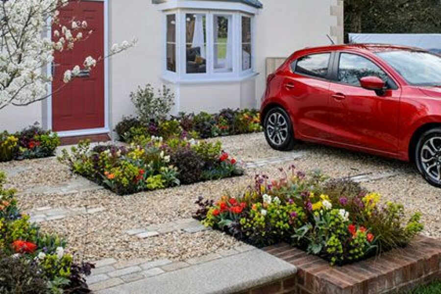 Cost of turning front garden into driveway?