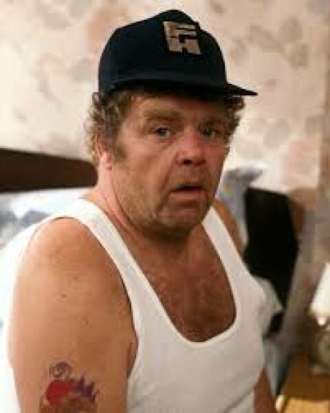 Is it acceptable for husband to wear white M&S vest in public???