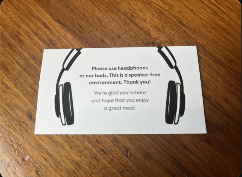 To ask older lady to wear headphones in cafe
