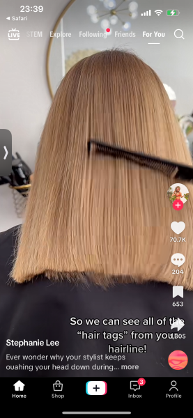 Made to stand and look down during haircut