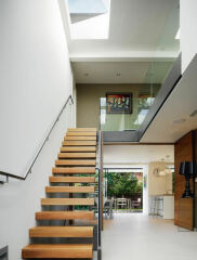 1970s "floating" style staircase with green carpet - what do I need to know and do?