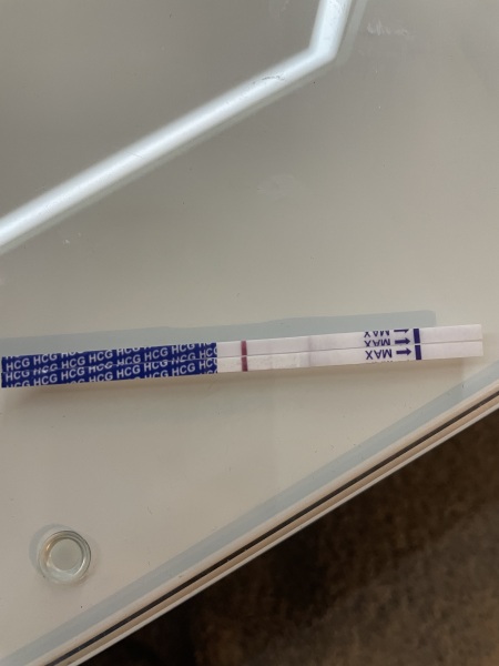 Faint line on cheap tests, negative on digital clear blue