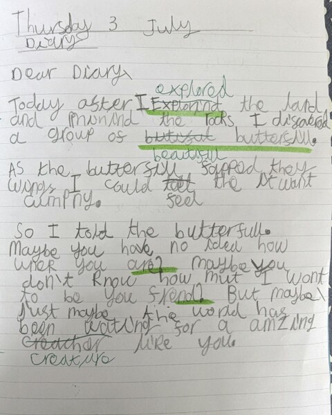 Another child writing one
