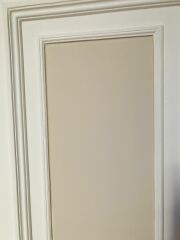 SW facing living room with pale pink couch.