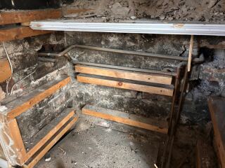 Opening up fireplace - central heating pipes inside!