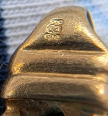 Hallmark on gold bracelet