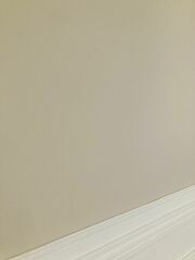 SW facing living room with pale pink couch.