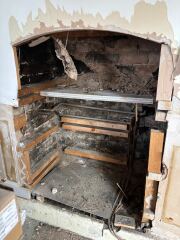 Opening up fireplace - central heating pipes inside!