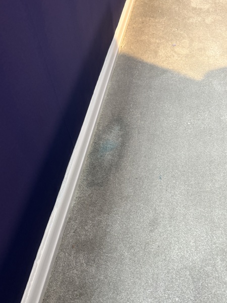 Not paying painter due to carpet stains?