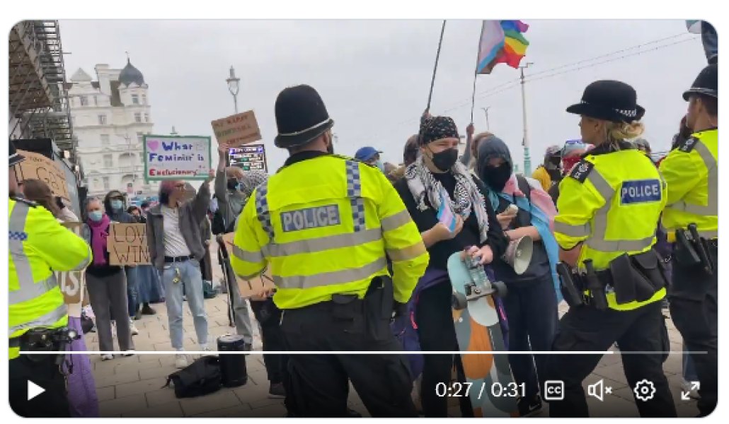 Men in dresses smashed all the windows of the Brighton centre last night because women arranged to meet and discuss their rights