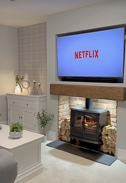 Log burner with sunken tv above...heat damage