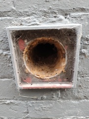 Holes in external walls from old pipes