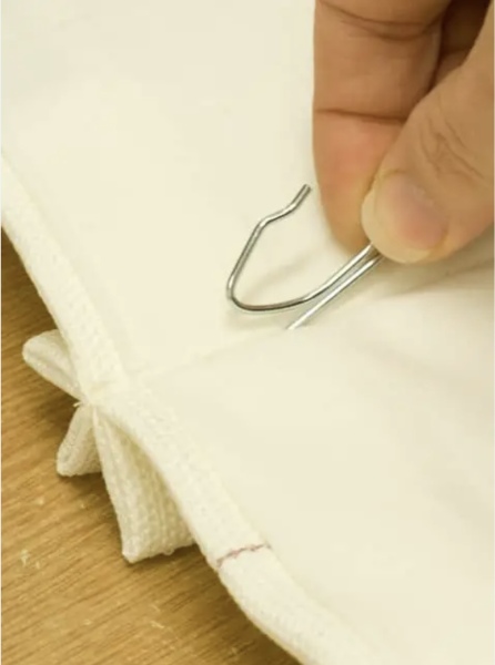 How do you hang up curtains that don't have rings built-in to allow them to be attached to a pole?