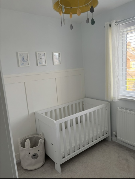 Baby cot near window/radiator