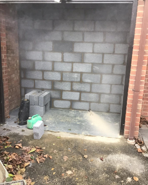 Is building a wall inside garage subject to building regulations?