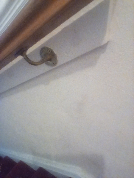 very small marks on wallpaper maybe an inch or two big i see about four or five theyre in the hall
