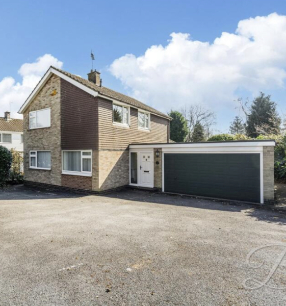 What colours windows and door with a dark green garage door