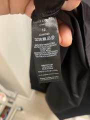Grey stains on black dress after washing - help