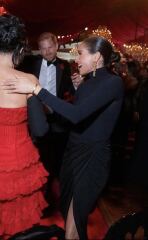 Harry appreciates a red dress ...