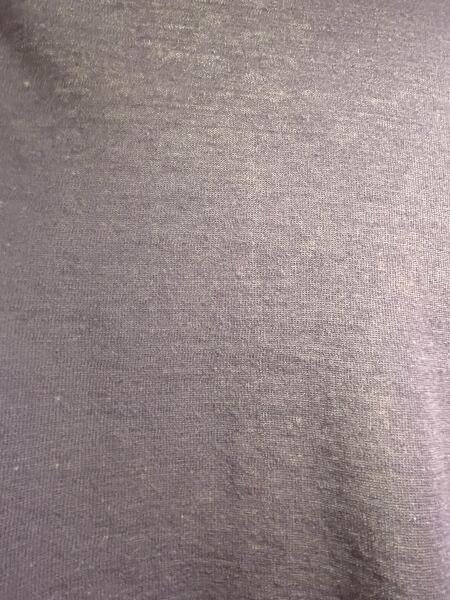 What caused these tiny white spots on my cotton sweater?