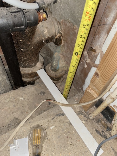 Help! Shower waste level trouble - how to adjust this copper to cast iron junction? (Pics)