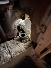 Help! Shower waste level trouble - how to adjust this copper to cast iron junction? (Pics)
