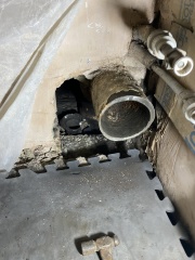 Help! Shower waste level trouble - how to adjust this copper to cast iron junction? (Pics)