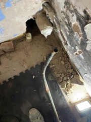 Help! Shower waste level trouble - how to adjust this copper to cast iron junction? (Pics)