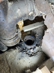 Help! Shower waste level trouble - how to adjust this copper to cast iron junction? (Pics)